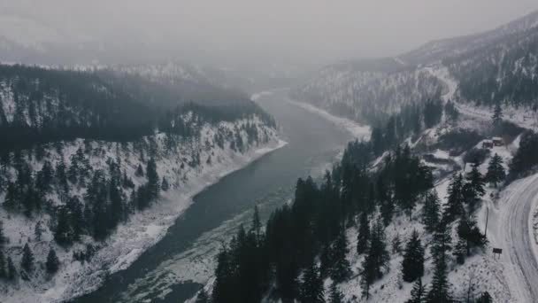 Aerial Shot Canadian River Ice Moving Surrounded Mountains Small Winding — Stock Video
