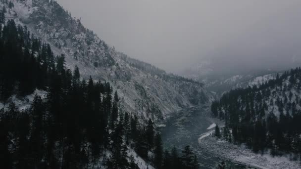 Aerial View Ice Moving River Surrounding Mountains Covered Snow — Stock Video