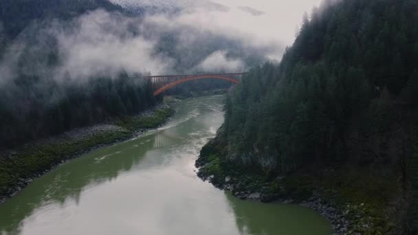 Flying Bridge White Car Passing River Surrounded Mountains — Stock Video