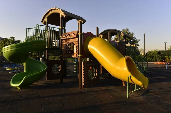 playground, park, play, slide, children, fun, child, outdoor, summer, colorful, oil, blue, kids, childhood, equipment, sky, game, green, swing, industry, yellow, school, activity, playing, leisure