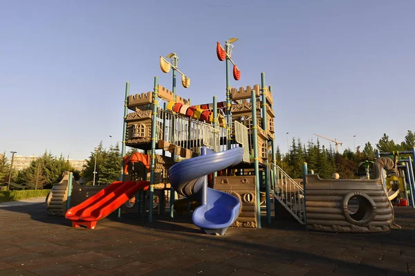 playground, park, play, slide, children, fun, child, outdoor, summer, colorful, oil, blue, kids, childhood, equipment, sky, game, green, swing, industry, yellow, school, activity, playing, leisure