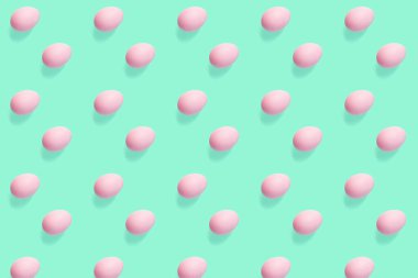 Düz arkaplan üzerindeki yumurta deseni modayı simetrik ve geleceksel