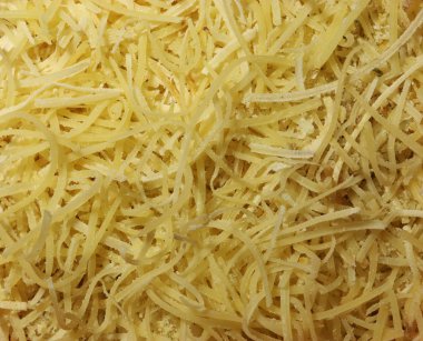 Yemek arkaplanı için rendelenmiş peynir deseni fotoğrafı