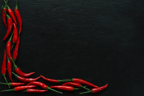 Photography of red hot peppers on slate background for restaurant menu — 스톡 사진