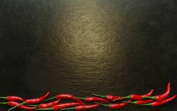 Photography of red hot peppers on slate background for restaurant menu — 스톡 사진
