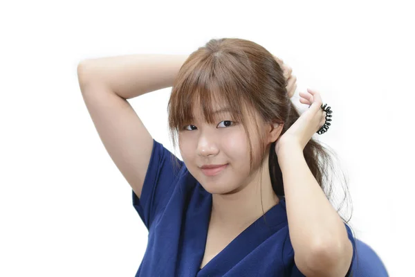 Gyönyörű ázsiai lány profil copf felett fehér háttere — Stock Fotó