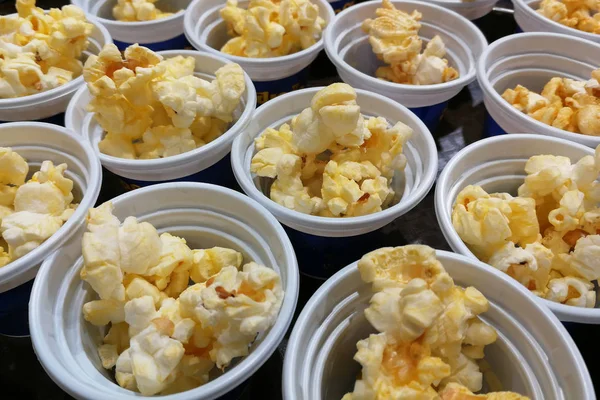 Appetizer : popcorn tester in white cups as background — Stock Photo, Image