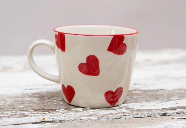 Valentine mug with red hearts — Stock Photo, Image