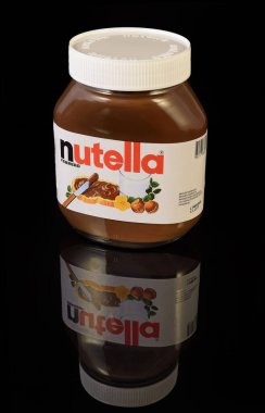 Jar of Nutella Hazelnut Spread. Nutella is the brand name of a hazelnut flavoured sweet spread by the Italian company Ferrero - illustrative editorial clipart