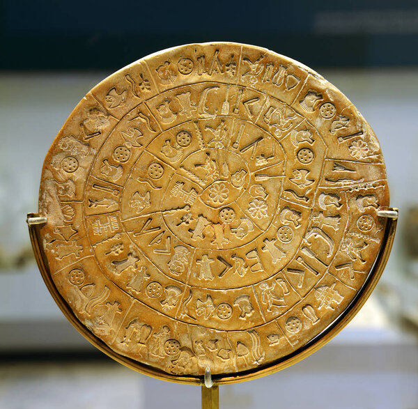 The Phaistos disk (sideA), disk of fired clay from the Minoan palace of Phaistos. The enigmatic inscribed clay disc takes pride of place in the history of Cretan scripts, Crete, Greece