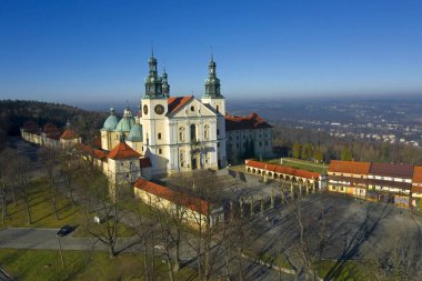 Kalwaria Zebrzydowska in Poland - UNESCO World Heritage Site. Landscape where there are pathways Calvary, pilgrimage destination. clipart