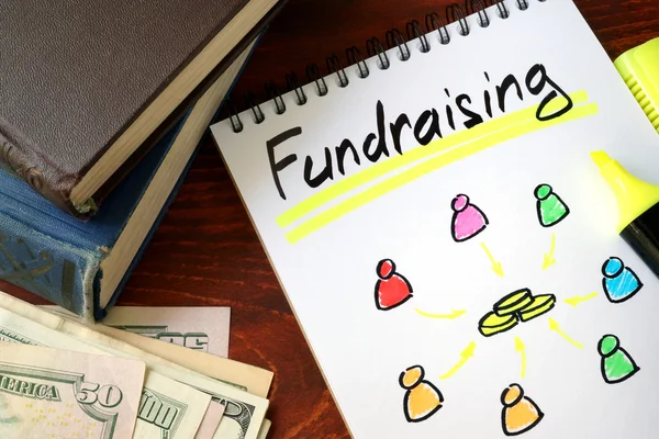 Recaudación de fondos escrita en un bloc de notas. Concepto de caridad . — Foto de Stock