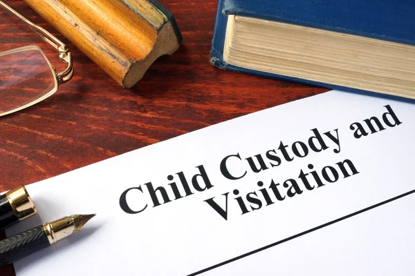 Child Custody and Visitation written on a paper and a book. — Stock Photo, Image