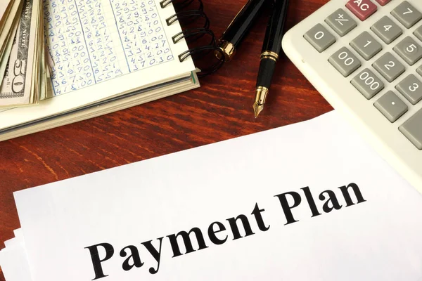 Papers with title payment plan. Business concept.