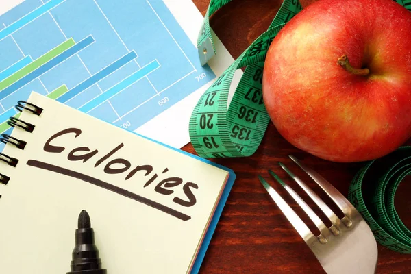 Calories written in a diary. Calorie counting concept. — Stock Photo, Image