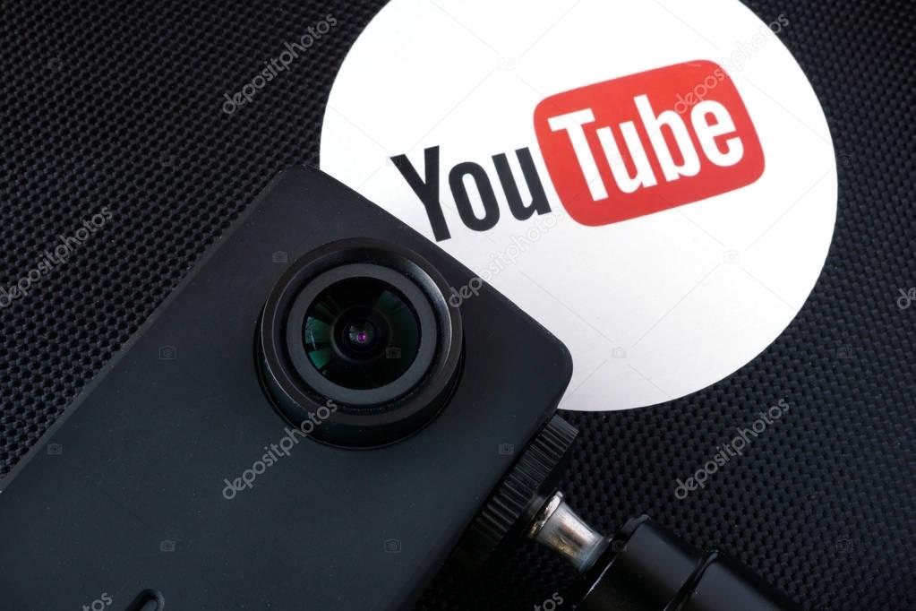 KYIV, UKRAINE - December 07, 2016: Youtube logo on a box and video camera. Vlogging concept.