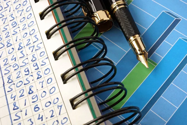 Financial graphs on a wooden surface.Business concept. — Stock Photo, Image