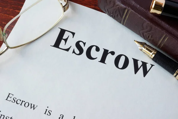 Paper with word Escrow and glasses on a table. — Stock Photo, Image