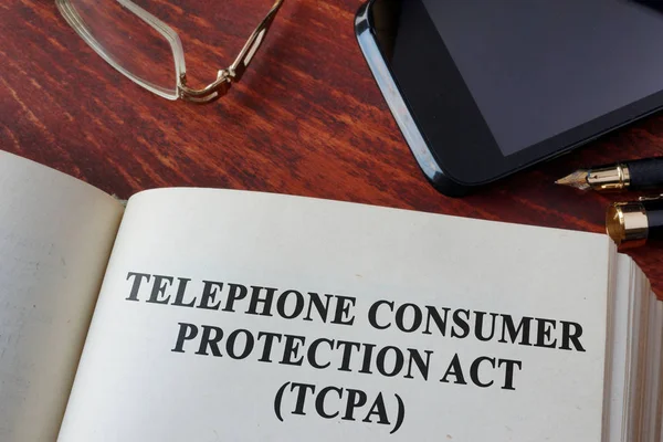Boka med kapitel The telefon Consumer Protection Act från 1991 (Tcpa). — Stockfoto