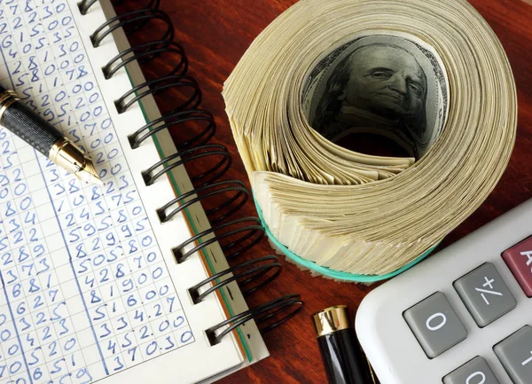 Ledger, pack of dollars and calculator. Accounting concept. — Stock Photo, Image