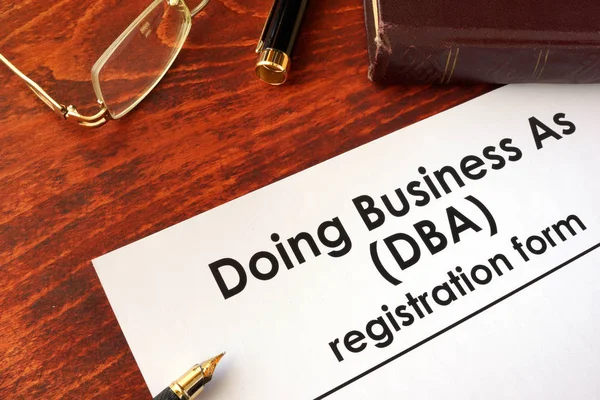 DBA Registration doing business as form on a table. — Stock Photo, Image