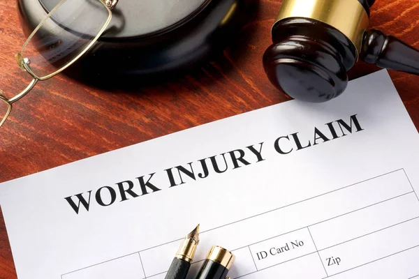 Work injury claim form on a table. — Stock Photo, Image