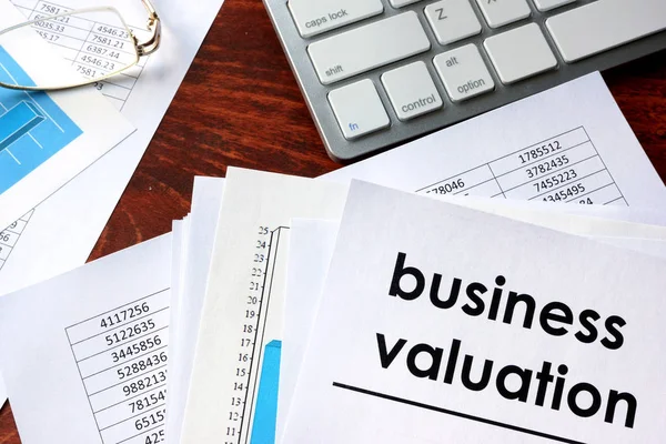 Business valuation written in a document business charts. — Stock Photo, Image
