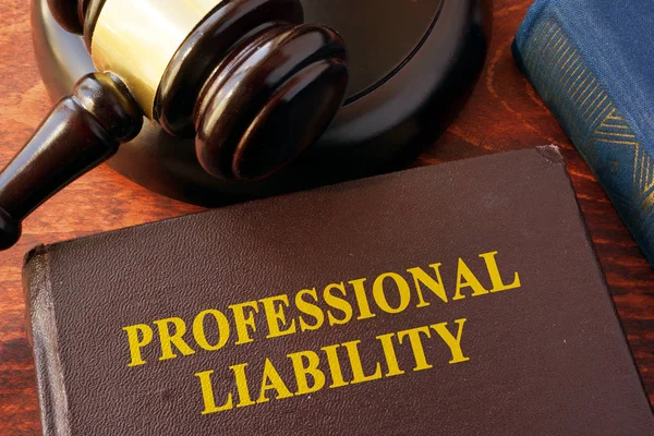 Book with title professional liability and gavel. — Stock Photo, Image