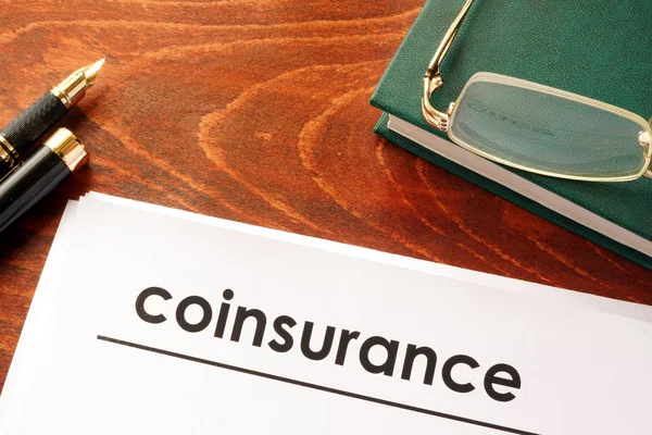 Document with title coinsurance on a table. — Stock Photo, Image