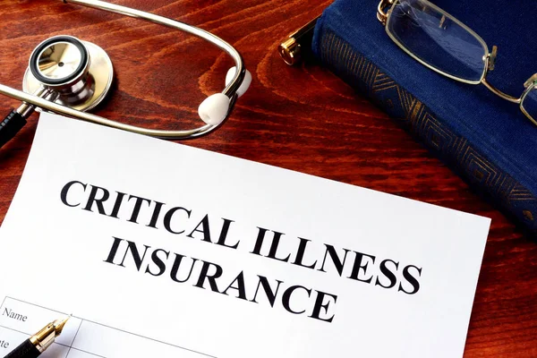 Critical illness insurance policy at the table. — Stock Photo, Image