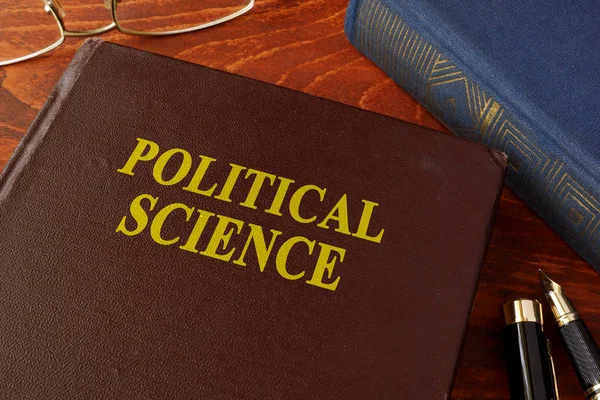 Book with title political science in an office. — Stock Photo, Image