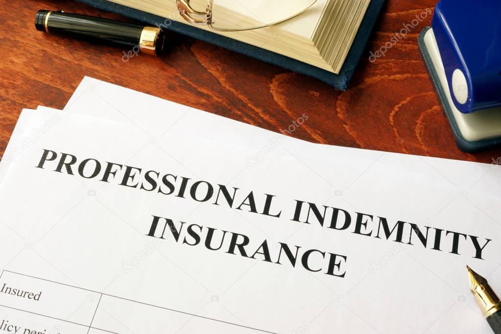Professional indemnity insurance policy on a table.