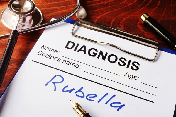 Medical form with diagnosis Rubella on a clipboard.