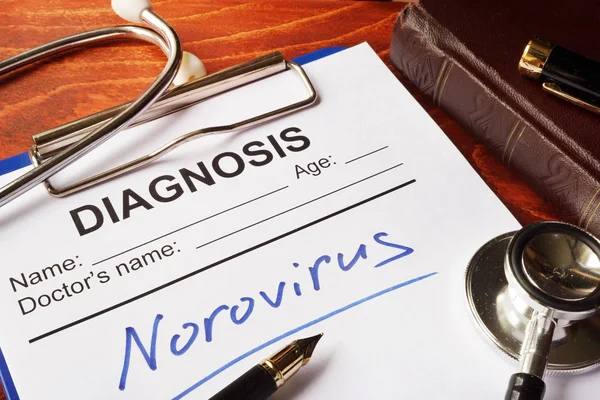 Forme médicale avec diagnostic Norovirus sur une table . — Photo
