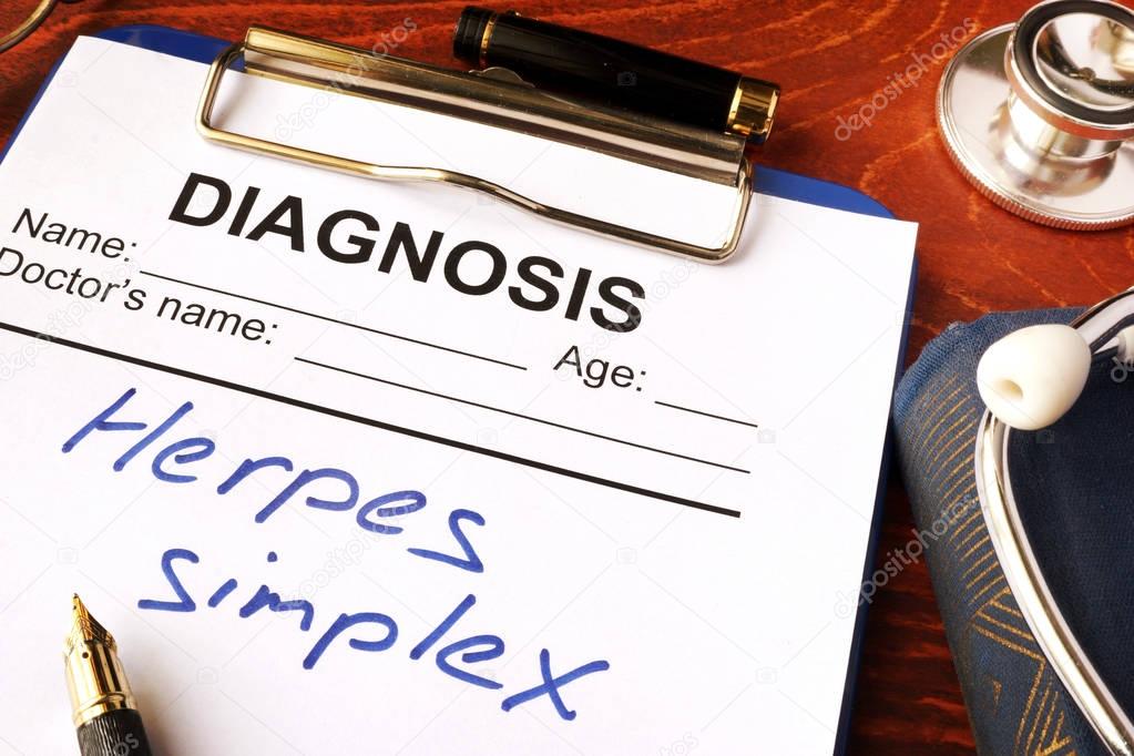 Herpes simplex written in a document on a table.