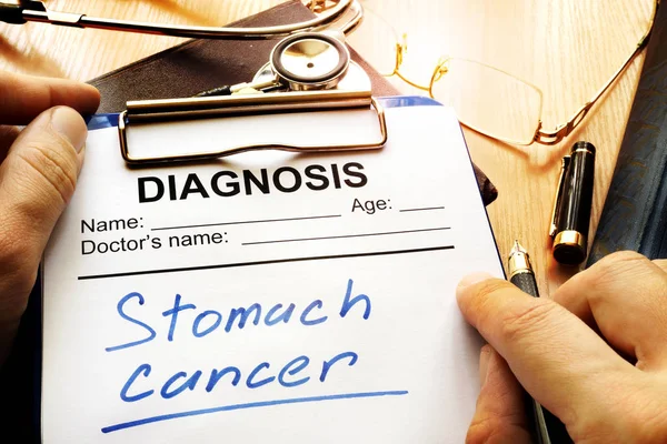 Stomach cancer diagnosis on a diagnostic form.