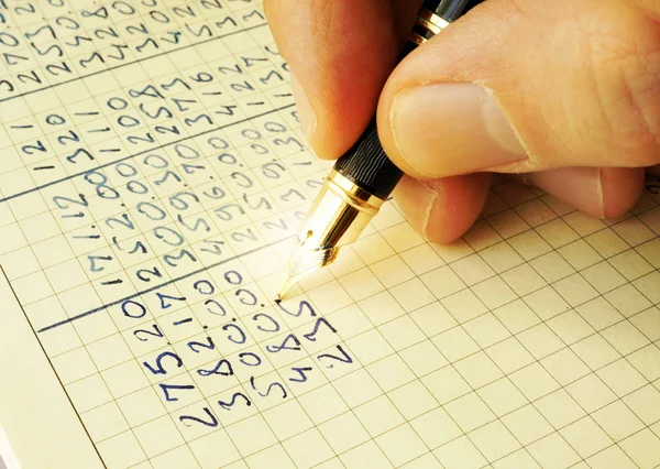 Hand writing financial data in a ledger. — Stock Photo, Image