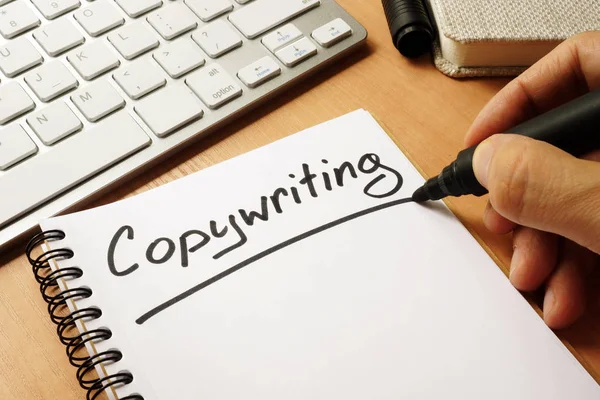 Hand is writing Copywriting on a note. — Stock Photo, Image