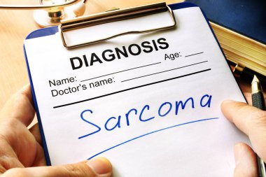 Diagnosis sarcoma in a medical form. clipart