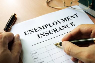 Unemployment insurance form on a table. clipart