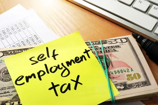 Self employment tax written on a memo stick. — Stock Photo, Image
