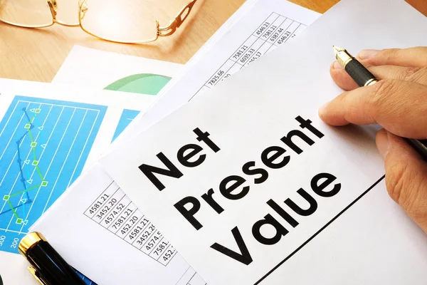 Net present value NPV documents on a table.