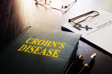 Book about Crohn's disease as type of inflammatory bowel disease (IBD). clipart