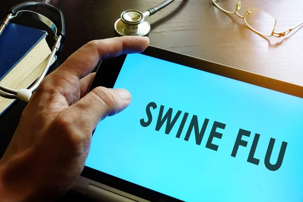 Swine Flu (Swine Influenza A (H1N1 and H3N2)) written in a tablet.