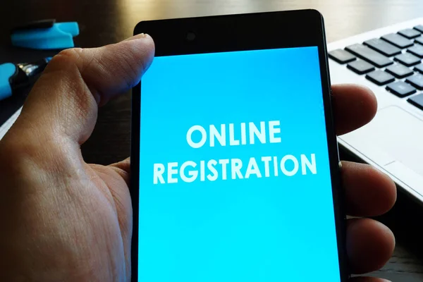 Man holding smart phone  with online registration. — Stock Photo, Image