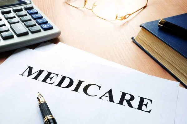 Medicare policy on a desk. — Stock Photo, Image