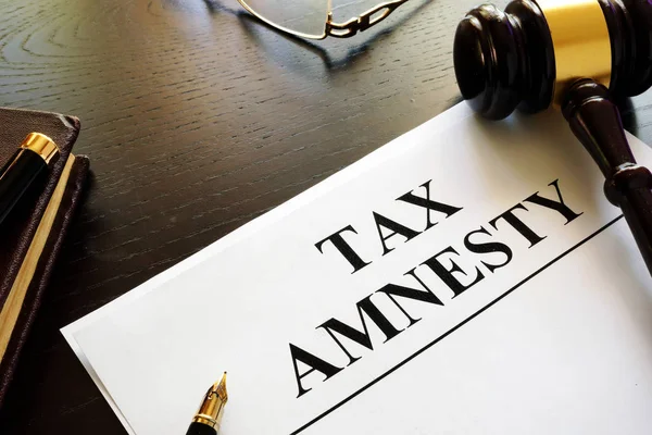 Papers about tax amnesty and gavel in a court. — Stock Photo, Image