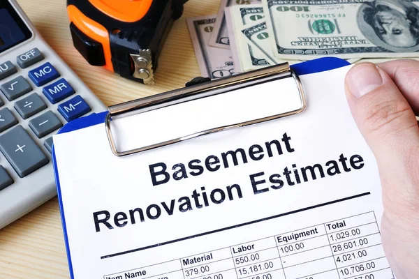 Clipboard with calculations basement renovation estimate. Remode — Stock Photo, Image