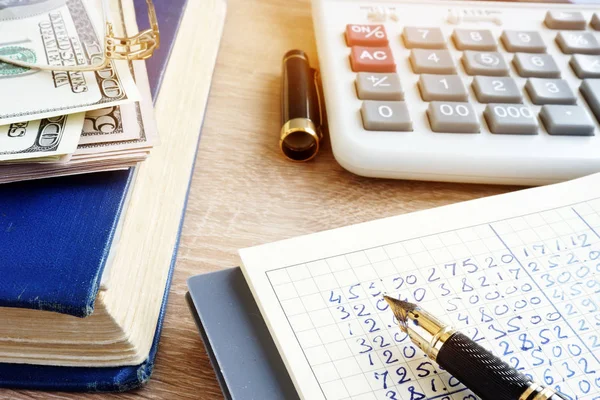 Accounting book, currency and calculator. Home finances. — Stock Photo, Image