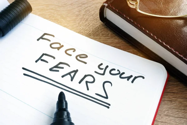 Face your fears written in a note. — Stock Photo, Image